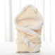 Newborn baby being hugged and swaddled by baby - Health and Wellness Innovations
