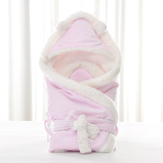 Newborn baby being hugged and swaddled by baby - Health and Wellness Innovations