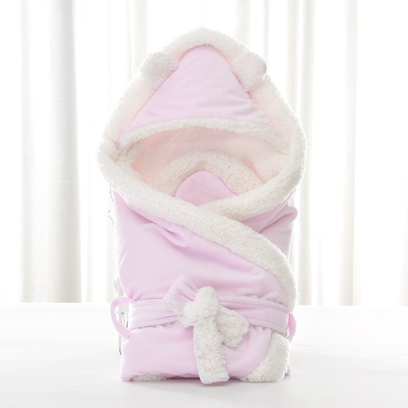Newborn baby being hugged and swaddled by baby - Health and Wellness Innovations