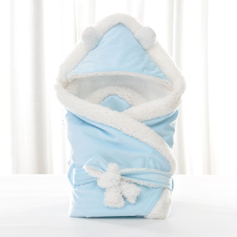 Newborn baby being hugged and swaddled by baby - Health and Wellness Innovations